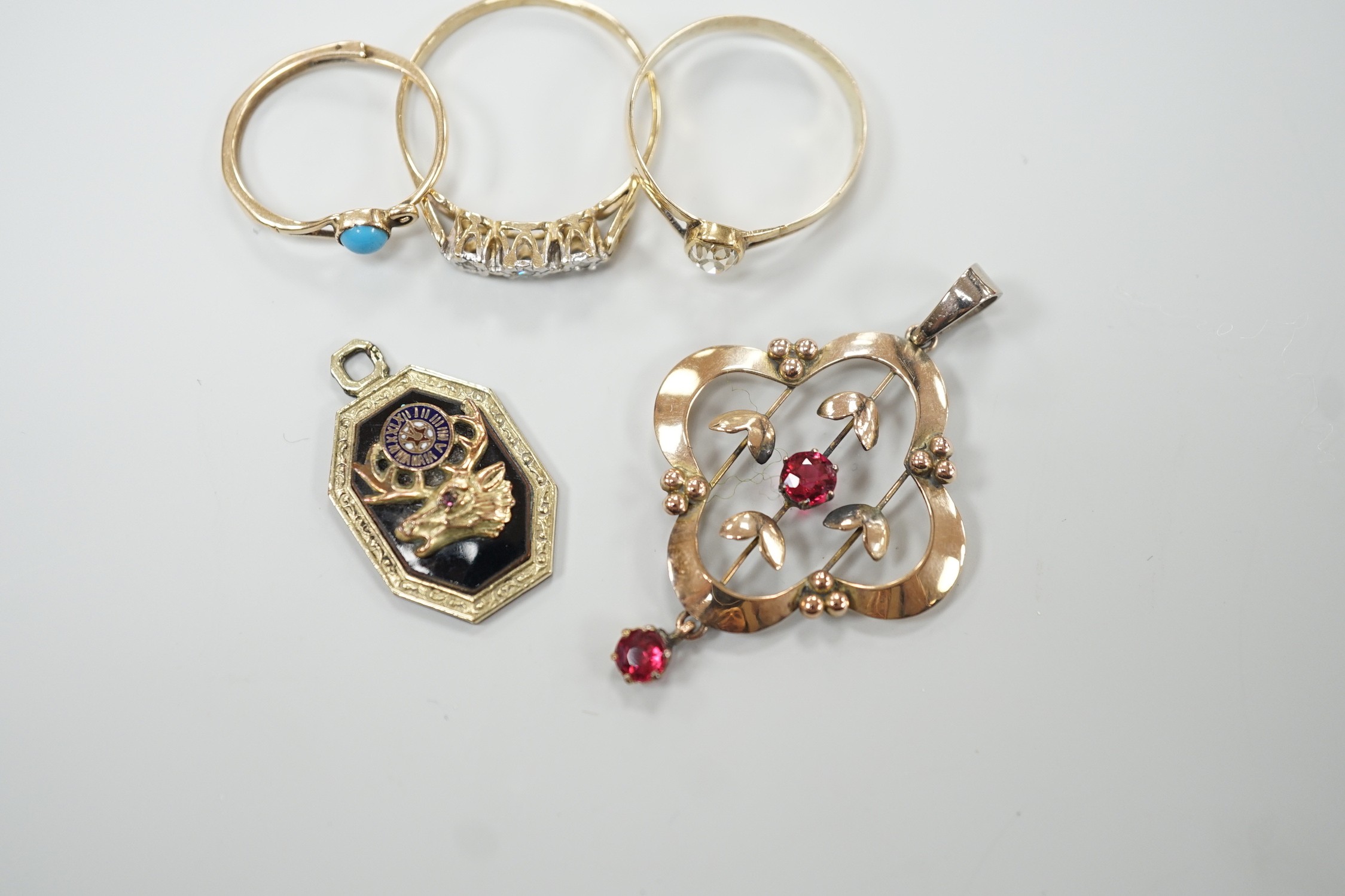 A yellow metal and old mine cut solitaire diamond set ring, size N, gross 1.1 grams, a 9ct gold and three stone diamond chip set ring, a yellow metal and turquoise set earring, an enamelled pendant and a 9ct and gem set